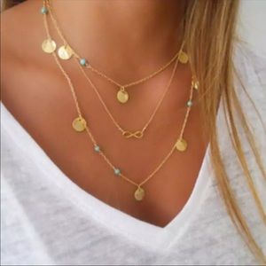 Gold bohemian eternity necklace with teal three layered